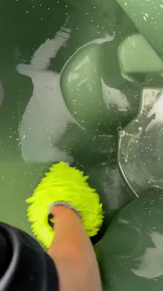 Scrubbing the inside of a trash bin during cleaning