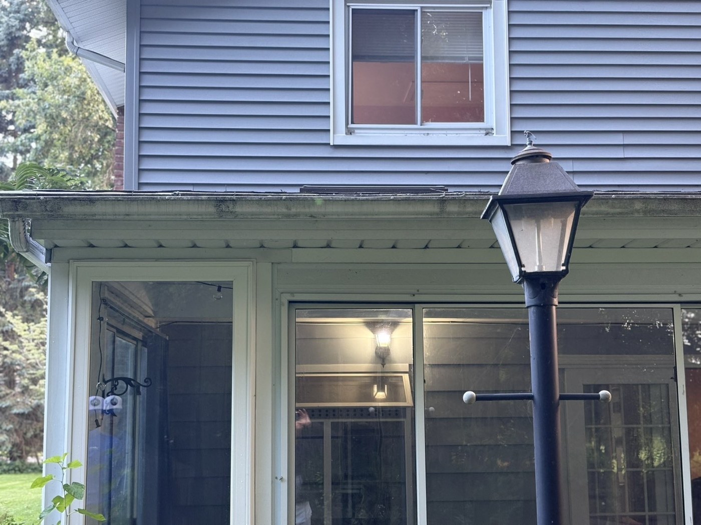 Gutter faces with dark streaking before a brightening wash