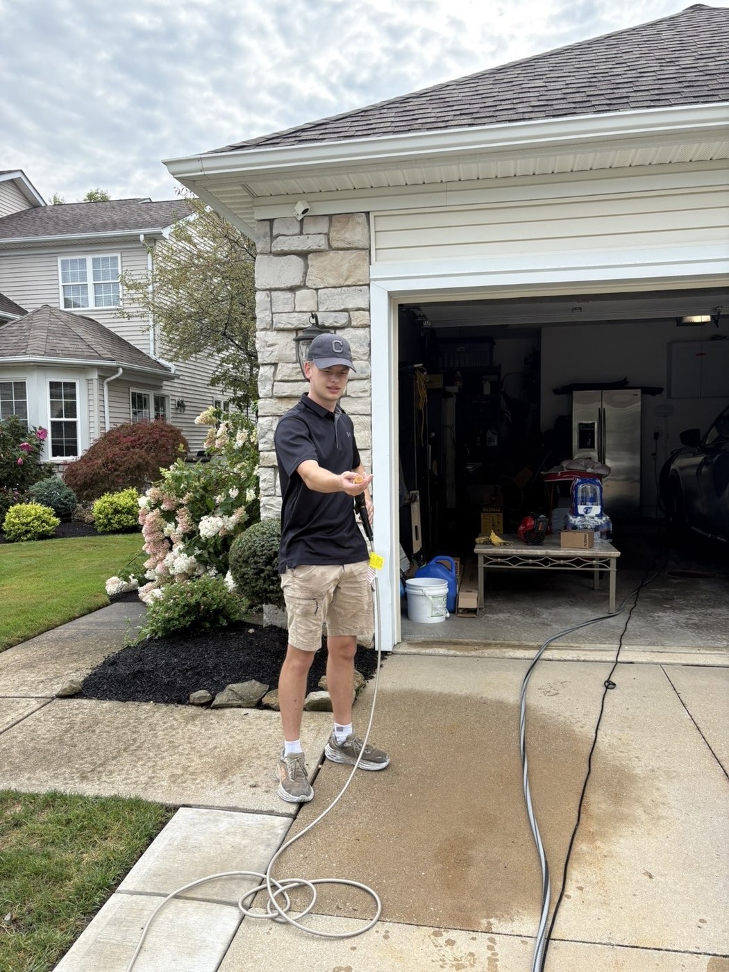 Lake Side Wash owner working on a residential driveway