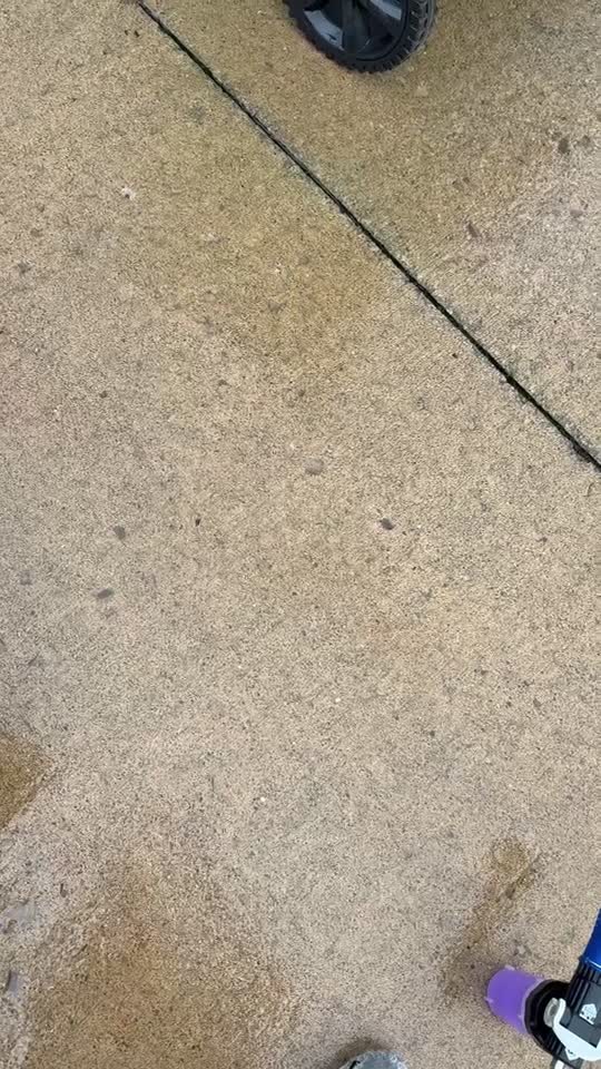 Surface cleaner washing a concrete driveway